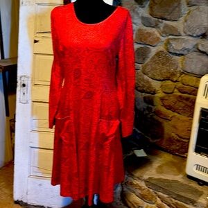 Fit and flare,  front patch pockets,black paisley design. No label, polyester